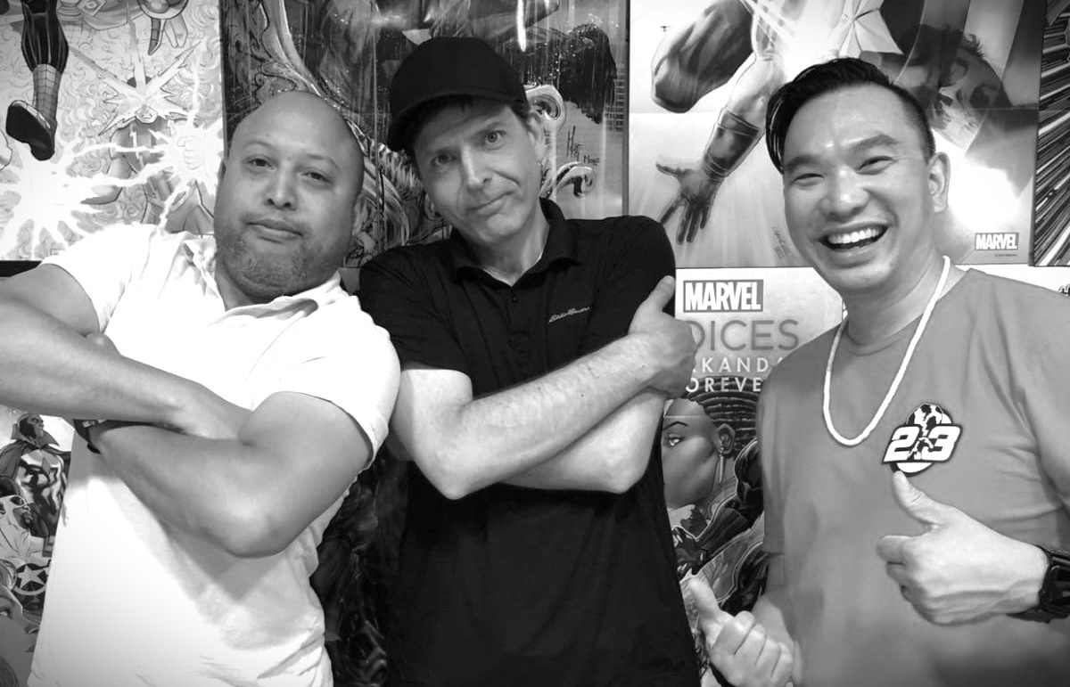 Author Francesco Coscarella standing alongside Andre Greenidge and Jon Ho, owners of Heroes World, at an author event from Of Myth and Men: The White Night by Francesco Coscarella